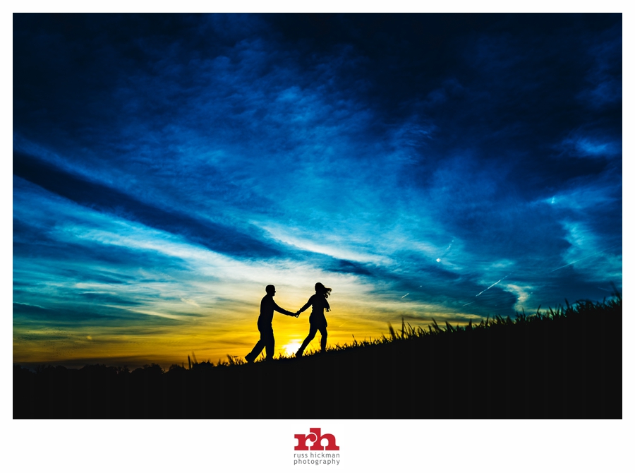 A silhouette of an couple walking in the sunset on their Philadelphia Engagement Session.